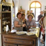 Vice-president Dorin Blau entertains visitors during lunchtime on the opening day of the exhibition.